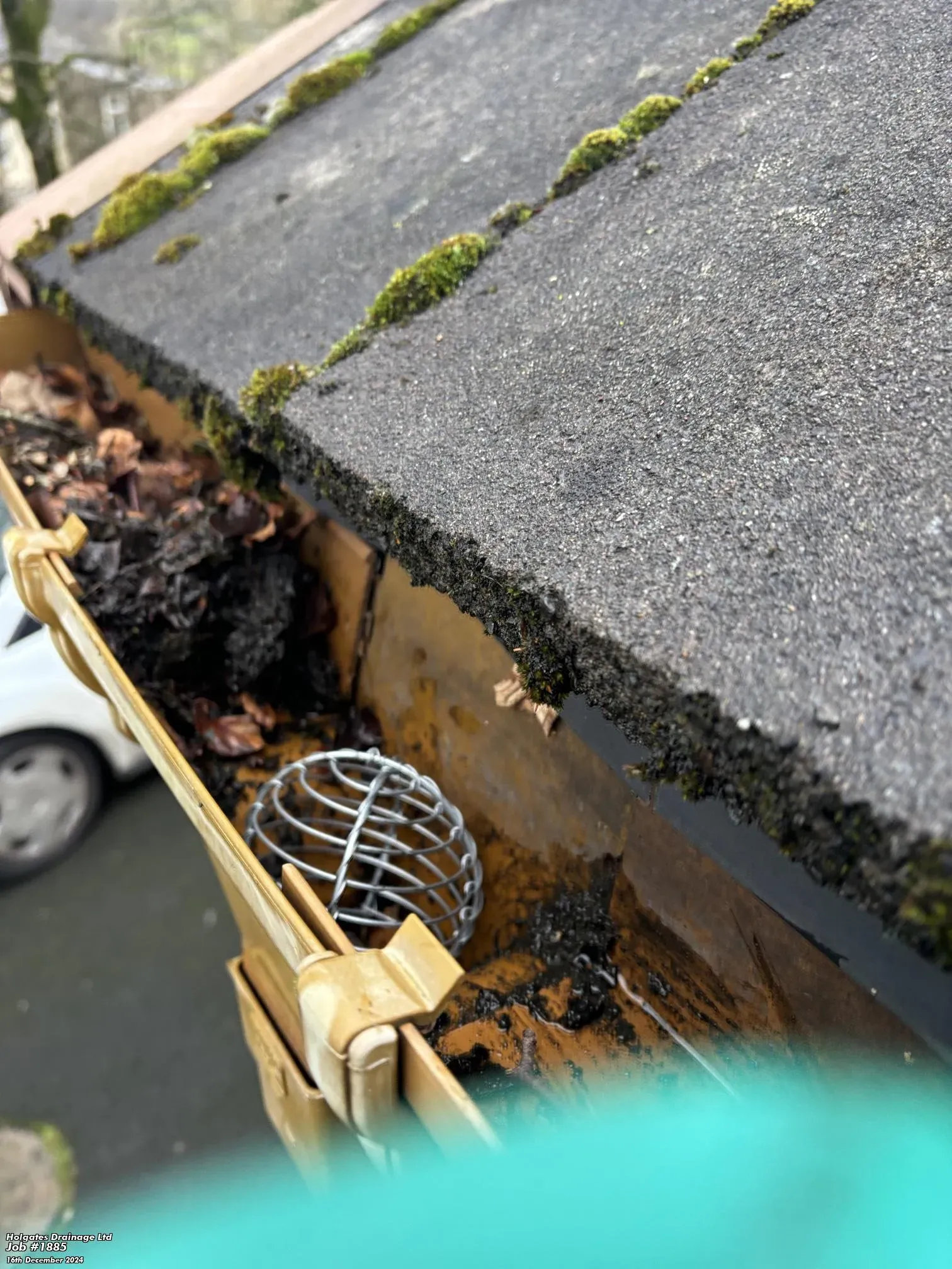 Blocked guttering filled with leaves and debris on a Lancashire property, highlighting the need for drainage maintenance.