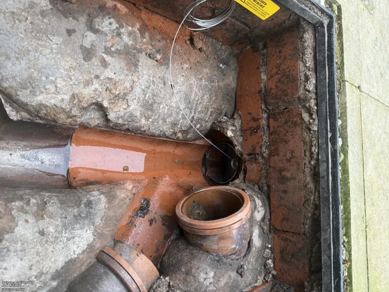 Professional rat gate installation in a drainage inspection chamber for rodent proofing in Blackburn.